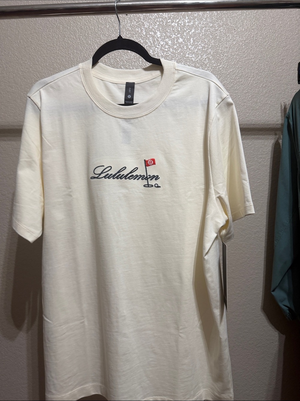 lululemon athletica Men’s Cream Logo Short-Sleeve Tee with Red Accent